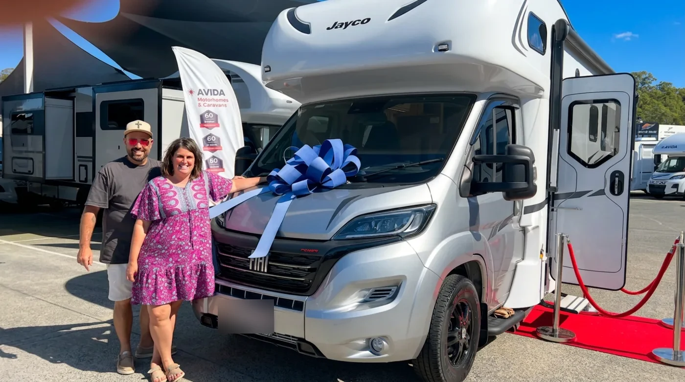 Couple collecting their financed Jayco motorhome