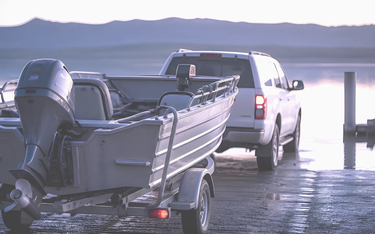 Boat on a trailer at an Australian boat ramp at dawn