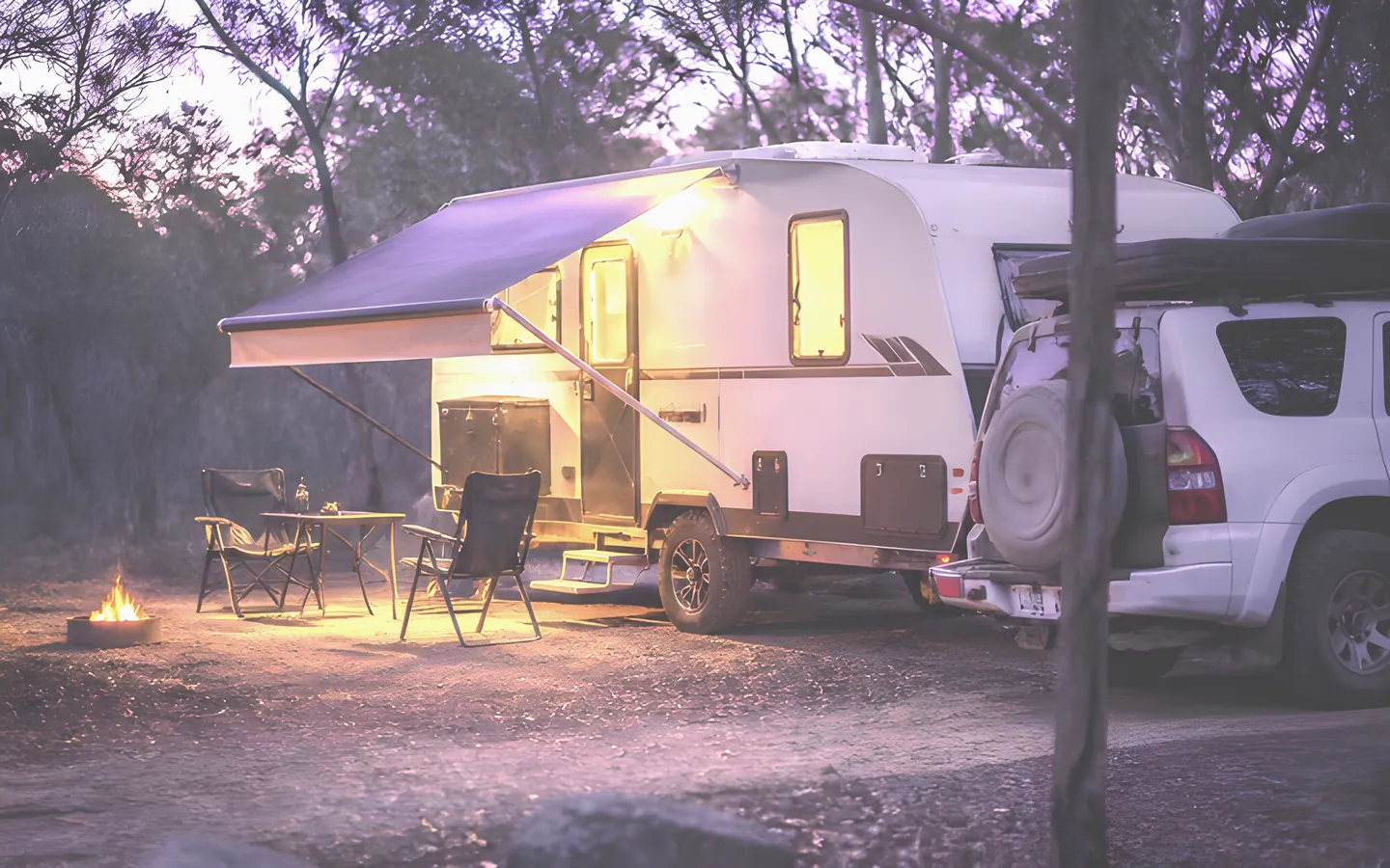 Caravan and four wheel drive at a bush campsite