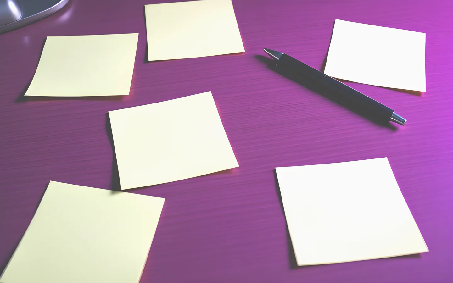 Question mark shapes on sticky notes across a desk