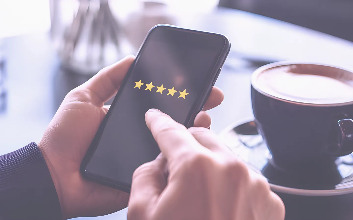 Customer leaving a five star review on a phone
